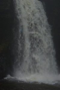 Girl behind waterfall